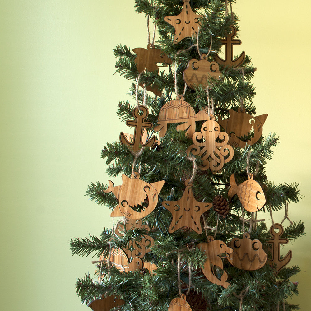 Ocean Animal Christmas Ornaments handmade in eco-friendly bamboo by Graphic Spaces displayed on Christmas tree