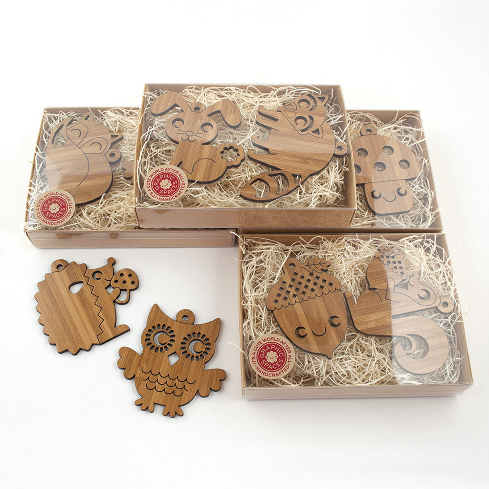 Wooden Animal Christmas Ornaments handmade in eco-friendly bamboo by Graphic Spaces in gift boxed packaging