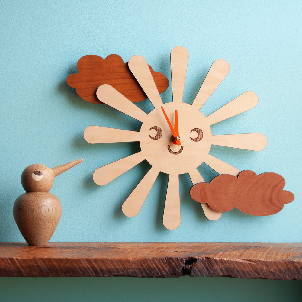 A collection of handmade wooden nursery clocks with playful original themed designs for baby & kids' rooms by Graphic Spaces