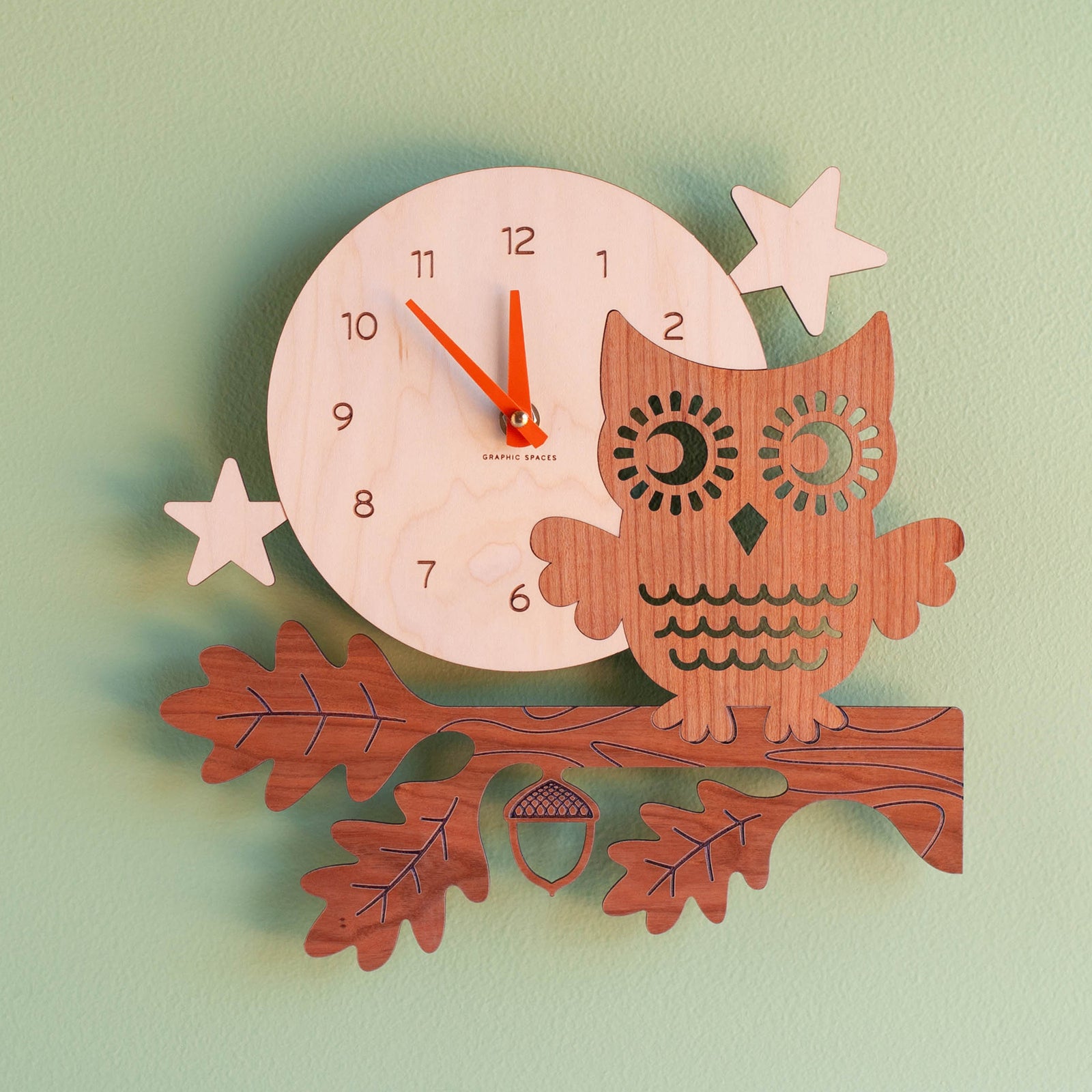 Wall Clock - Night Owl (Wood) Cherry and Maple - Pumpkin Hands - Front view on wall - Family Made in TN, USA - Graphic Spaces