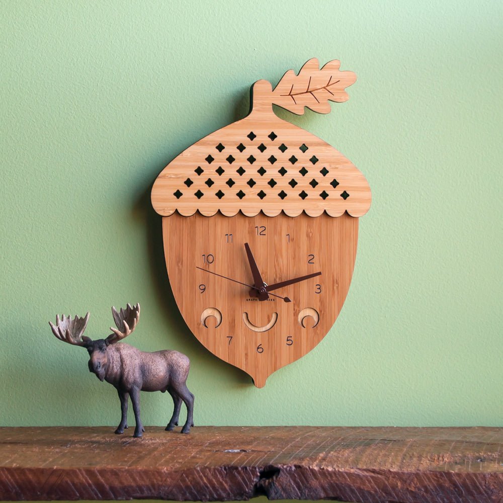 Wall Clock - Acorn (Bamboo) Shown with white hands on green wall  - Handmade in TN, USA - Graphic Spaces
