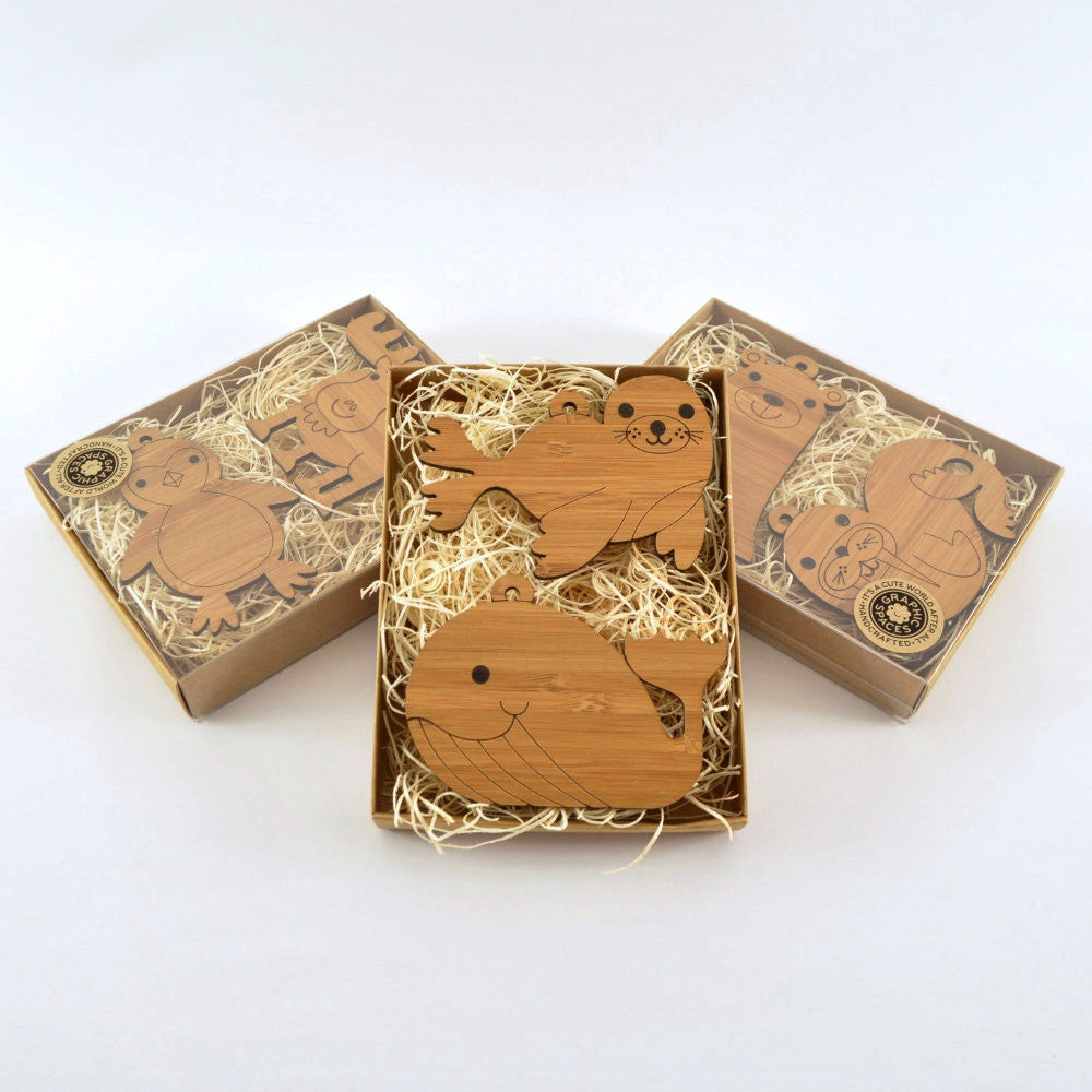 Wooden Animal Christmas Ornaments handmade in eco-friendly bamboo by Graphic Spaces in gift boxed packaging