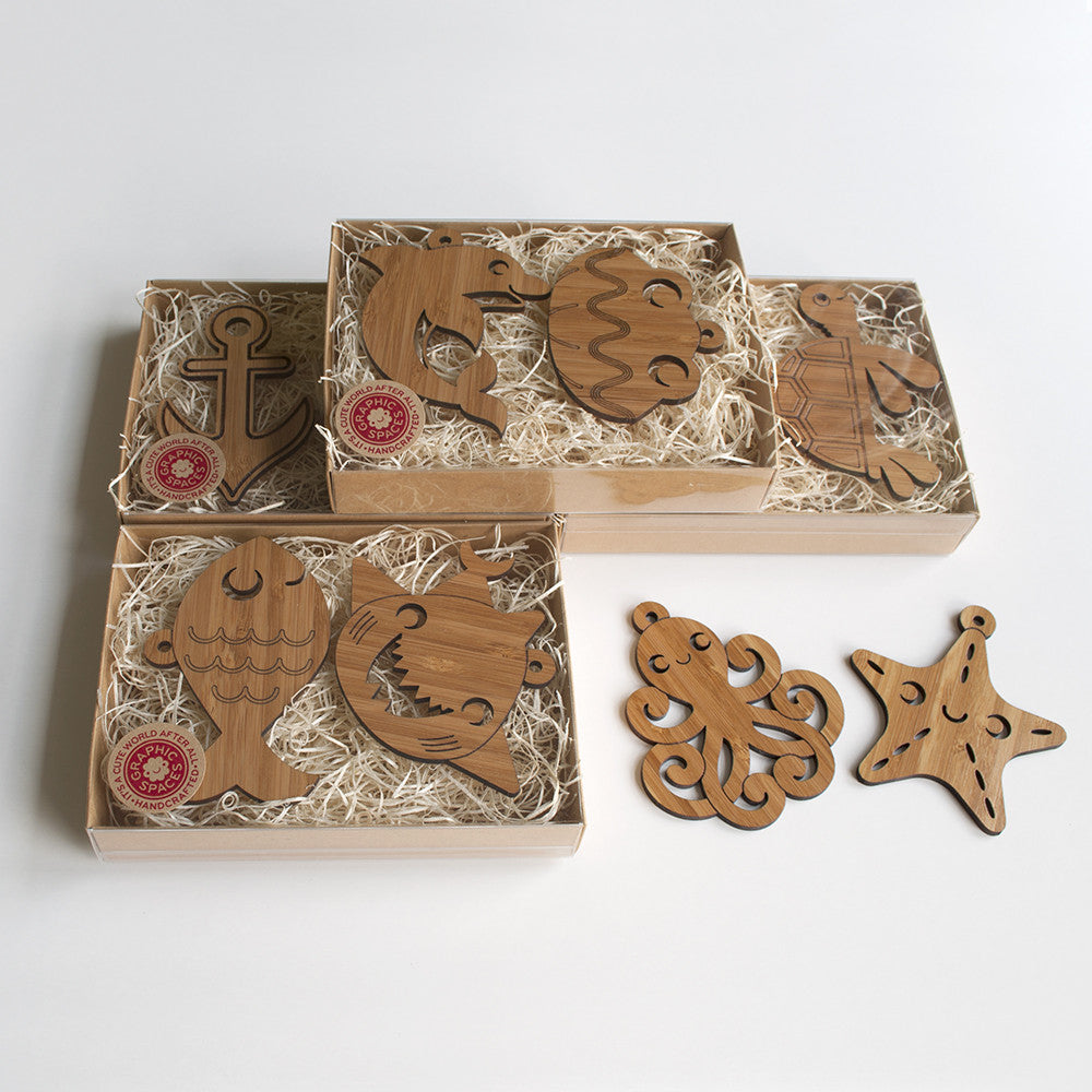Wooden Animal Christmas Ornaments handmade in eco-friendly bamboo by Graphic Spaces in gift boxed packaging